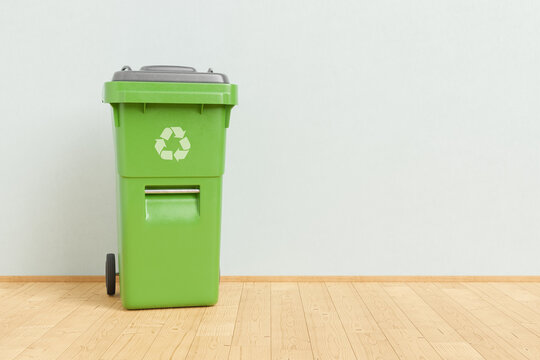 Recycling bin placed near wall