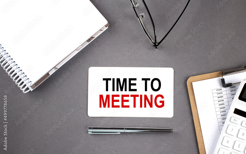 Poster time to meeting text written on the card with notebook and clipboard, grey background