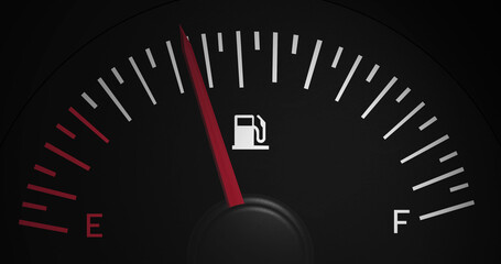Fototapeta premium Image of fuel gauge moving over black background
