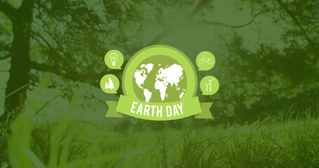 Image of earth day text over globe and grass with trees