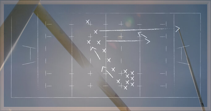 Image of drawing of game plan over rugby ball