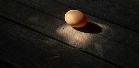 Chicken egg on a wooden background. Concept: market, eggs, food