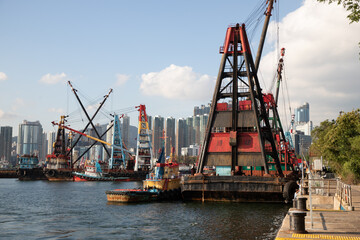 Obraz premium various marine vessel or dredger fitted with devices to scrap or suck the sediment or transport fill materials for land reclamation
