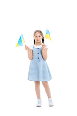 full length view of girl in blue strap dress holding small ukrainian flags on white.