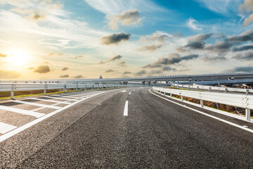 Asphalt highway and beautiful sky cloud landscape at sunset. Road and sky cloud background.