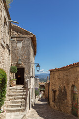Typical for vernacular architecture buildings, constructions, streets of restored old village Lacoste under blue sky,&nbsp;Vaucluse, France