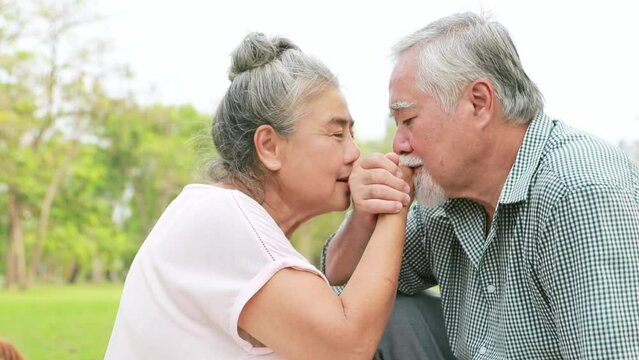 Happy family life insurance concept : Moments for elderly couples retired asian couples showing friendship, love, romance, bonding, holding hands, fragrant, miss you all the time.