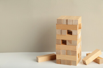 Blocks of wood on grey background, Strategy game as a business plan for team work