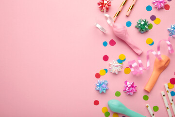 Colorful carnival or party frame of balloons, streamers and confetti on pink background. Space for text
