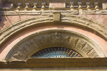 Rich decoration of old historical building in Old Town of Bologna