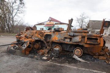 Fototapeta premium Russian infantry fighting vehicle (BMP) in the village of Brovarsky district, Kiev region. Footage after the battle of Ukrainian and Russian soldiers