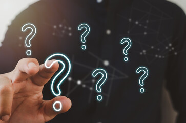businessman pointing a question mark. Business concept.
