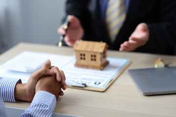 Real estate concepts. Real estate agent or lawyer discussing about the terms of the home purchase...