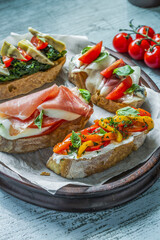 Italian food, Antipasto, Bruschetta, Baguette, Jamon, Prosciutto, Vegetables, Mushrooms, Prosciutto di Parma on Served Table, Restaurant Food