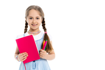 cheerful girl with colorful felt pens and copy book looking at camera isolated on white.