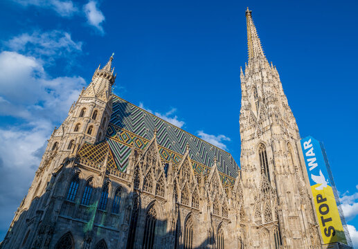 ukrainian flag with text stop War hanging at St. Stephen's Cathedral or Stephansdom in Vienna Austria