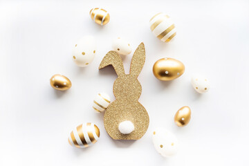 Cute easter bunny and golden eggs isolated on white background. Happy Easter minimal concept,...