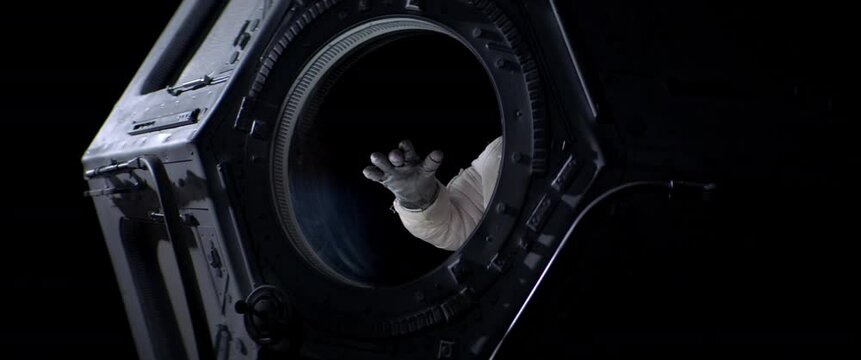 Portrait of Caucasian female astronaut flying towards spaceship cupola window. Space exploration, Mars mission. Shot with 2x anamorphic lens