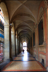 Fototapeta na wymiar Typical architecture with colonnade in the Old Town of Bologna, Italy