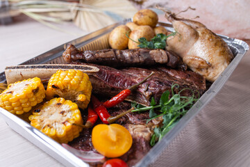 foil box with meat products. food delivery