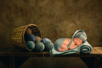 Baby sleeping with wool balls