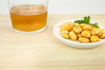 Spanish Tapa of Lupin Beans next to cold beer