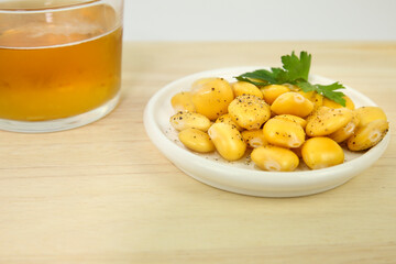 Spanish Tapa of Lupin Beans next to cold beer