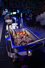 assorted sausages in metal marmite at the event