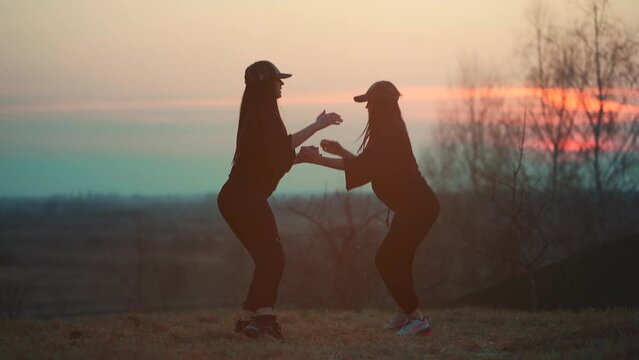 two female athlete have fitness workout and exercise on fresh open air at sunset