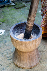 Pesting beans in a Ukhal musal (Mortal and Pestle)