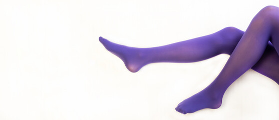 Legs of a beautiful young girl in lilac tights. White background.