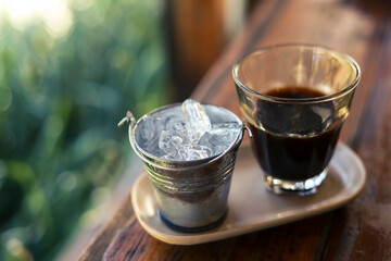 selective focus metal ice cup with hot Americano black coffee Looks beautiful and delicious coffee...