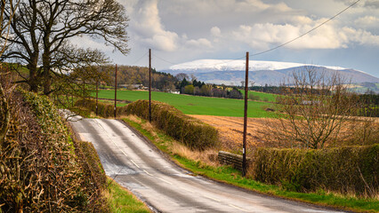 Snow capped Cheviot from Duddo, as part of the borderlands section on the Northumberland 250, a scenic road trip though Northumberland with many places of interest along the route