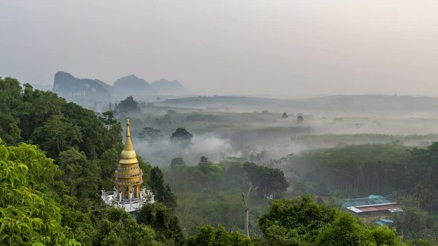 Aerial view of golden stupa or pagoda at Khao Na Nai Luang Dharma Park in Surat Thani Thailand on an early morning