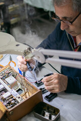 a technician repairing a radio