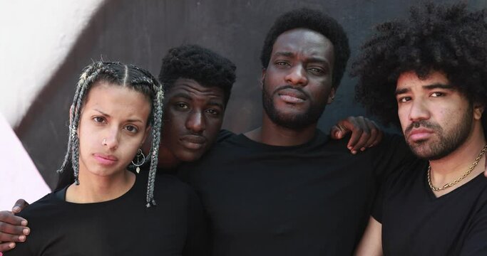 Group of young african people looking on camera outdoor 