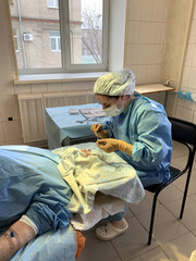 Ophthalmologist performs a complex operation to restore the cornea of eye