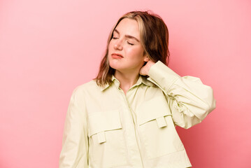 Young caucasian woman isolated on pink background having a neck pain due to stress, massaging and touching it with hand.