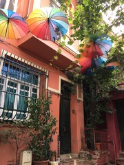 old istanbul house and colorful umbrellas