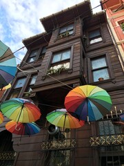 old istanbul house and colorful umbrellas