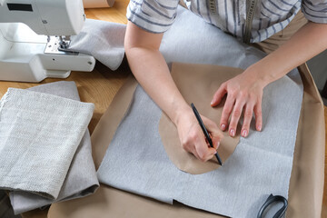 Sewing. Recycling Made by hand from home.sewing machine and the project quarantine, lockdown.Hobby,meditation,zero waste,recycling.Girl sews clothes home on sewing machine, ecology,sewing backround