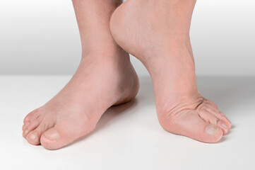 men feet after pedicure on white background. well-groomed feet of an adult man