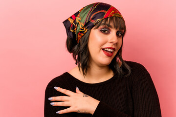 Young caucasian makeup artist woman isolated on pink background