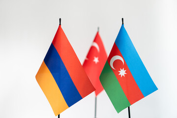 State flags of Azerbaijan Armenia and Turkey on light background. Karabakh conflict concept