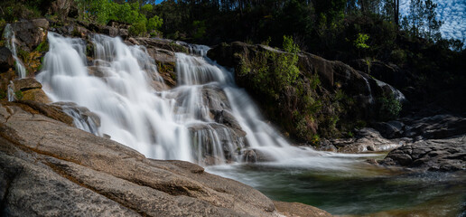 Obraz premium view of the Cascata Fecha de Barjas waterfalls in the Peneda-Geres National Park in Portugal