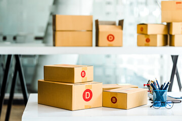 Cardboard box delivery logistic prepare at SME shop, modern office.