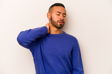 Young hispanic man isolated on white background having a neck pain due to stress, massaging and touching it with hand.