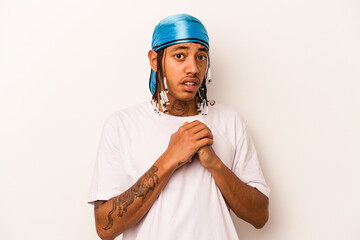 Young African American man isolated on white background scared and afraid.