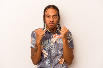 Young African American man isolated on white background showing fist to camera, aggressive facial...