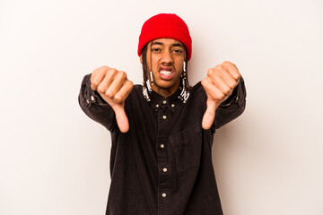 Young African American man isolated on white background showing thumb down and expressing dislike.